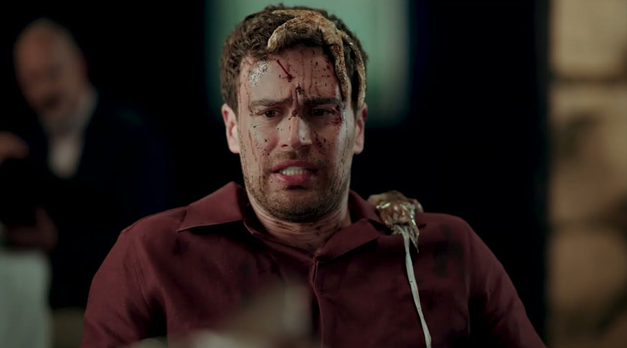 Title photo (still from the "The Bottom Line"): a man facing the camera with a disturbed facial expression, with maritime creatures on his head and shoulder